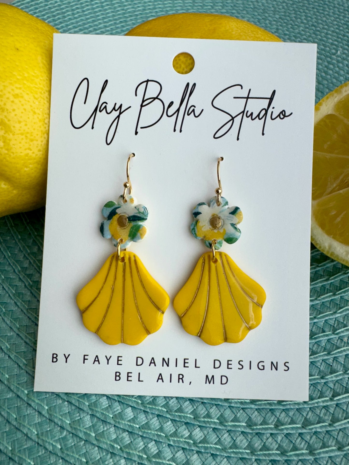 Statement earrings pair lemon colored shells with a soft floral accents