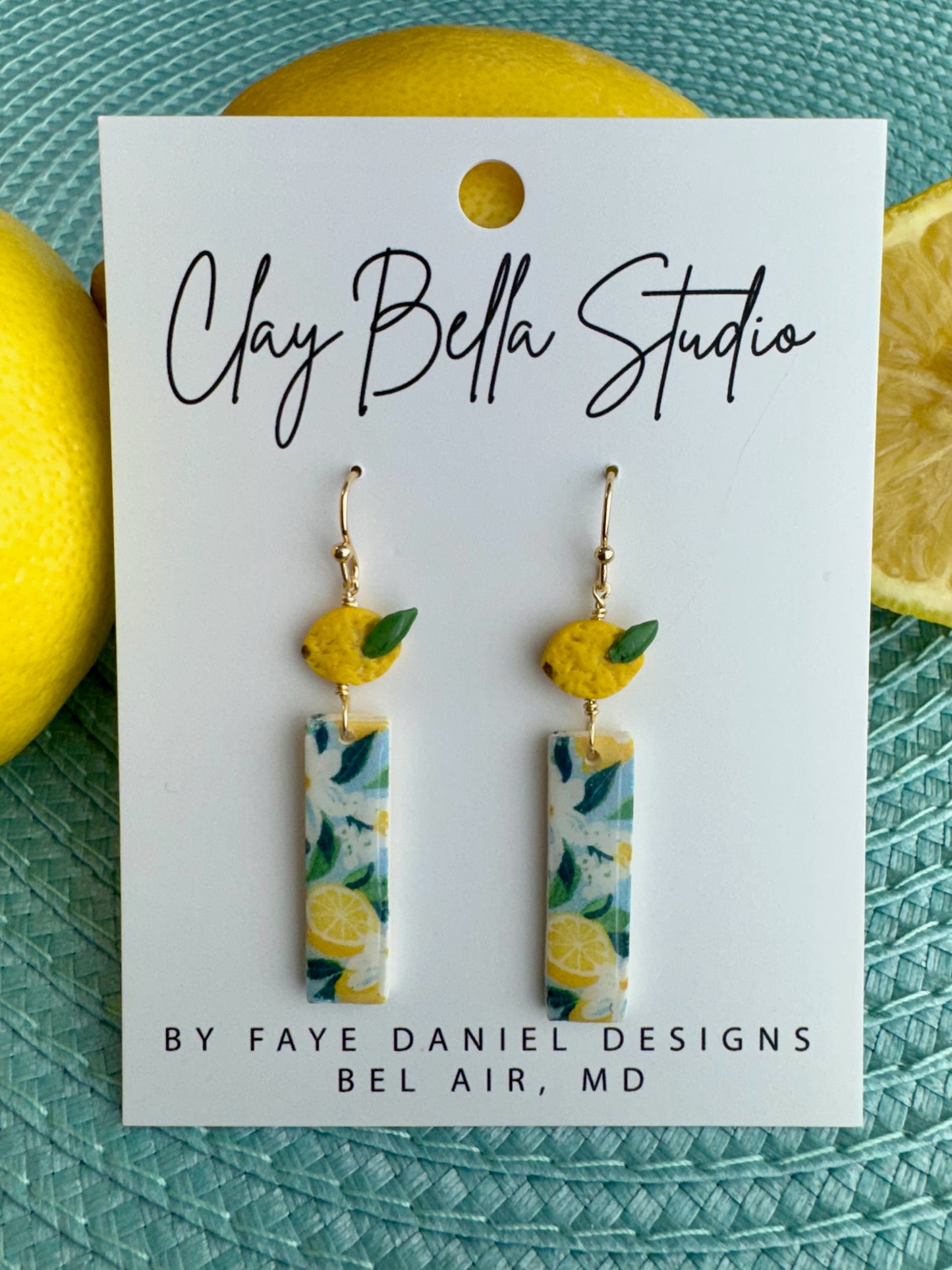 Handmade lemon earrings with sculpted lemon top and rectangular citrus patterned rectangular drop