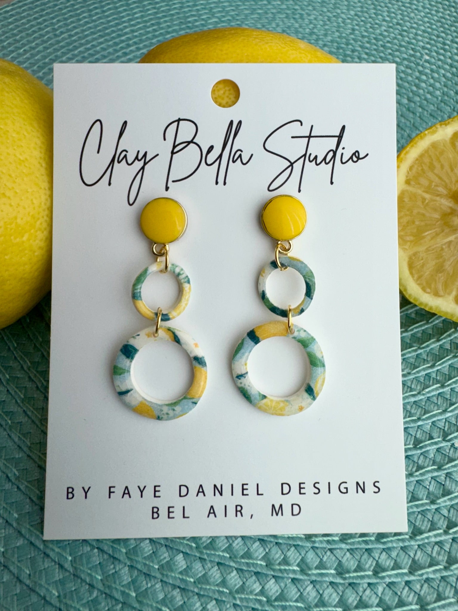 Yellow stud earrings with double marbled clay hoops in lemon and blue tones, handmade polymer clay earrings