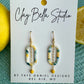 Oval citrus and aqua clay earrings with gold chain drop and yellow bead, coastal handmade earrings