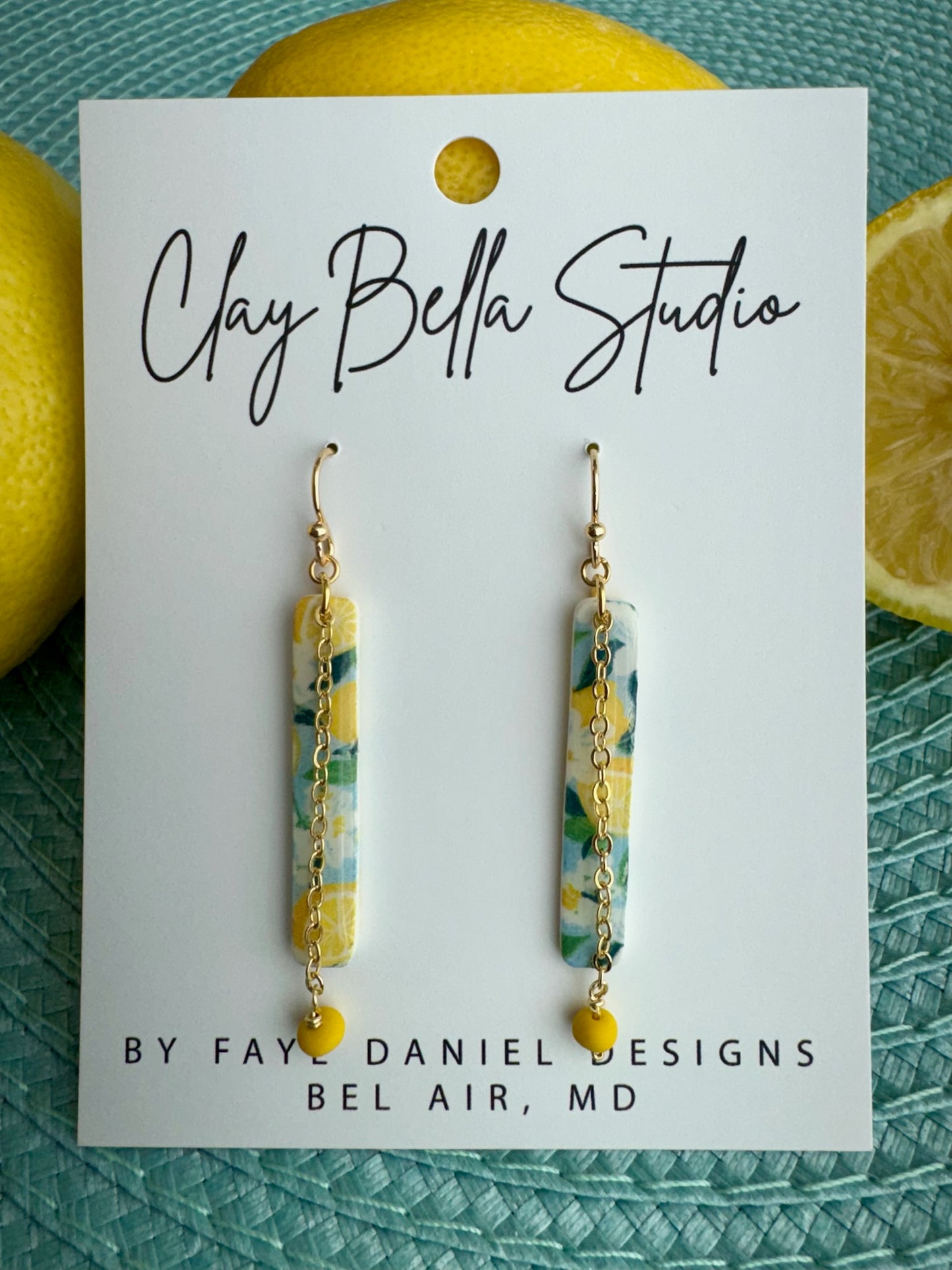 Rectangular drops feature a hand-mixed lemon pattern paired with a delicate chain and handmade beads.
