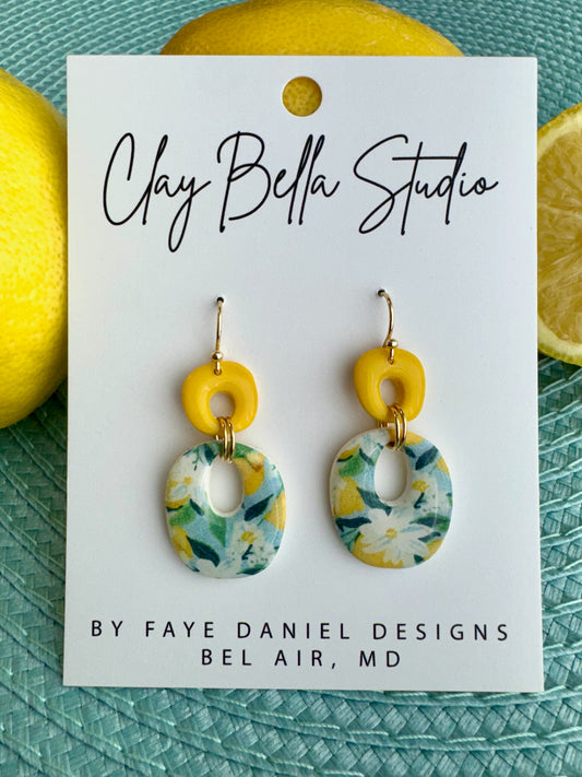 Handmade polymer clay earrings with yellow top and floral oval citrus pattern drop