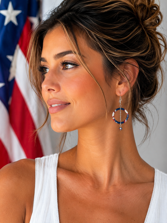 Model wearing Red, white & beautiful handmade patriotic hoop earrings by Clay Bella Studio