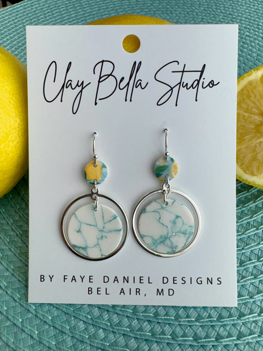 Silver hoop earrings with marbled aqua clay circle in seafoam and white tones, polymer clay