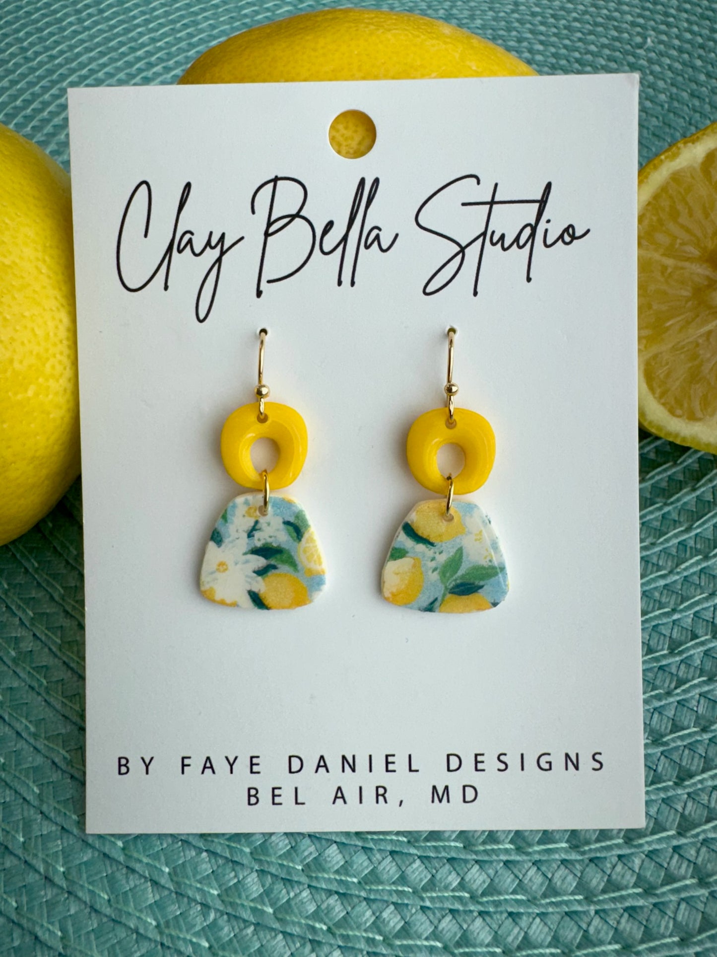 Handmade floral polymer clay earrings with yellow top and citrus pattern drop