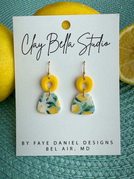 Handmade floral polymer clay earrings with yellow top and citrus pattern drop